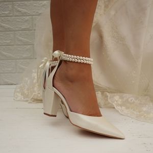 White bridal heels with pearl straps